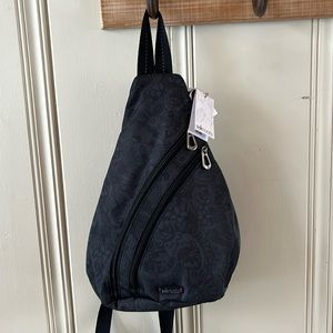 Sakroots Black Sling Backpack for Women— color: Black Tonal Spirit Desert